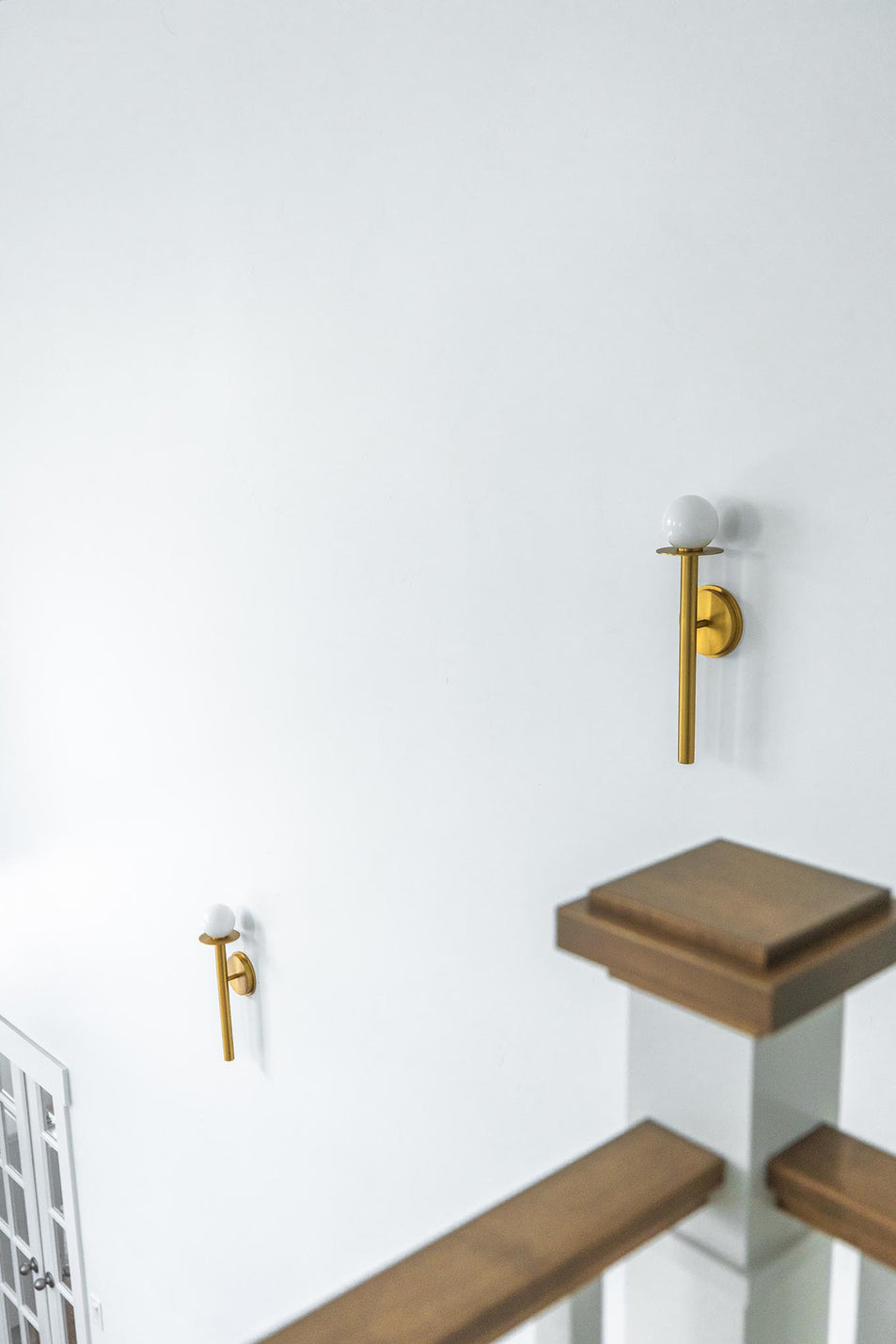 Nodes Sconce in Burnished Brass with White Glass