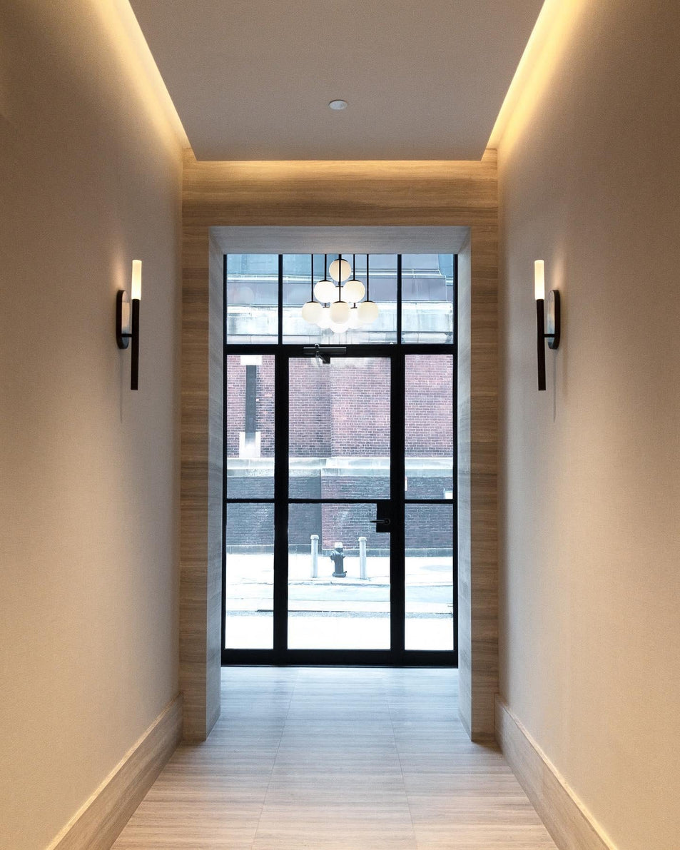 Rousseau Medium Bath Sconce, a premium Decorative light by Visual Comfort & Co. Close - up image of its design.