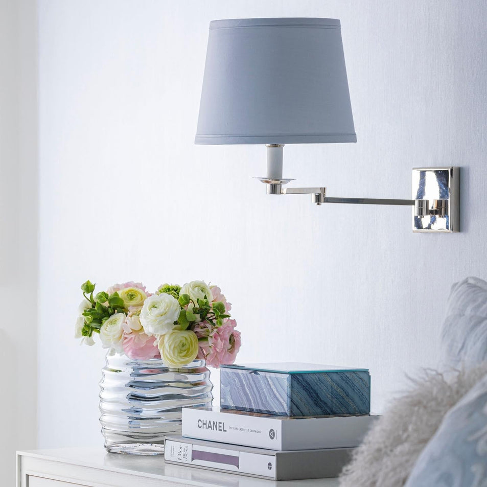 Evans Swing Arm Sconce, a premium Functional light by Visual Comfort & Co. Close - up image of its design.