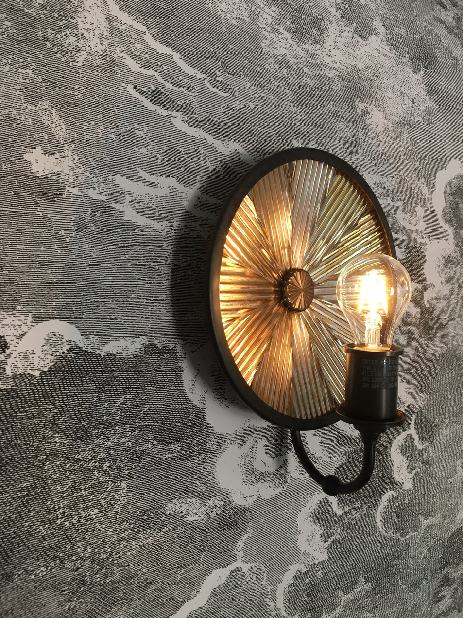 Rivington Small Round Sconce, a premium Decorative light by Visual Comfort & Co. Close - up image of its design.