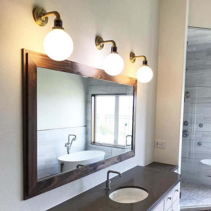 McCarren Single Sconce, a premium Bath light by Visual Comfort & Co. Close - up image of its design.