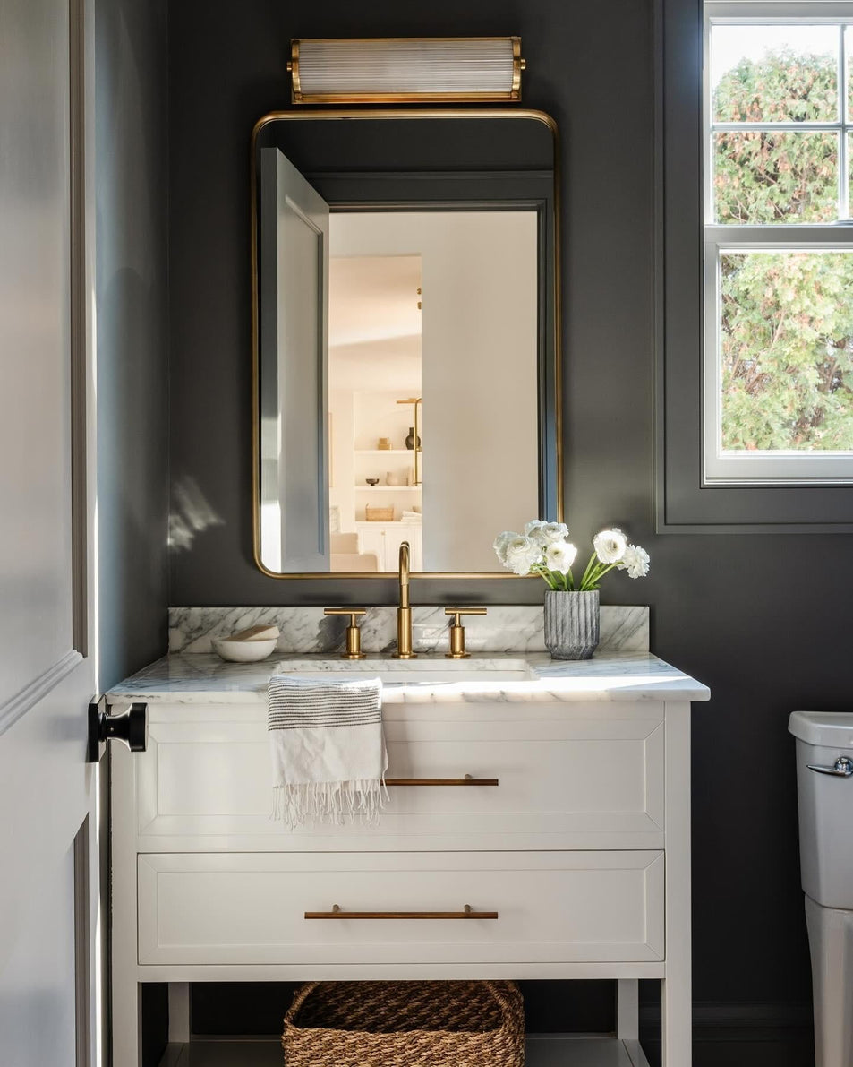 Dresser Long Glass Rod Light, a premium Bath light by Visual Comfort & Co. Close - up image of its design.