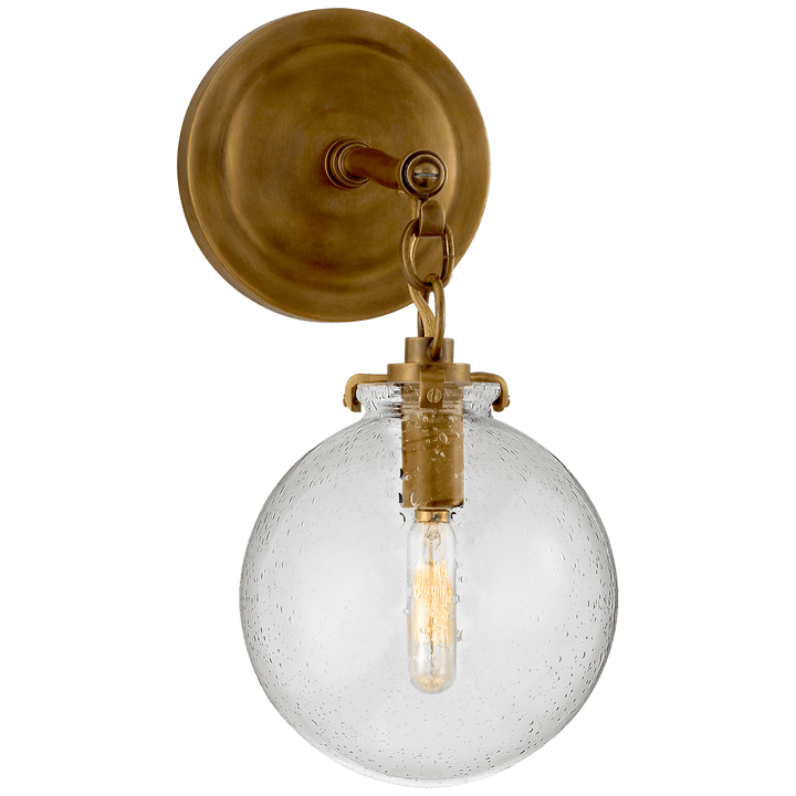 Katie Small Globe Sconce, a premium Bath light by Visual Comfort & Co. Close - up image of its design.